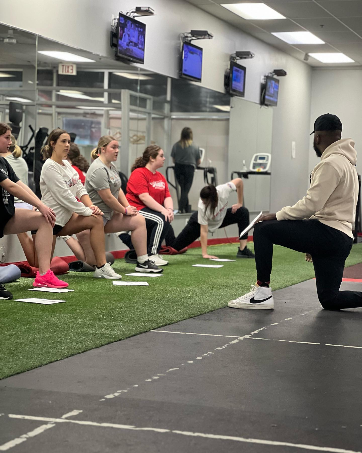 DJ coaching a group training session